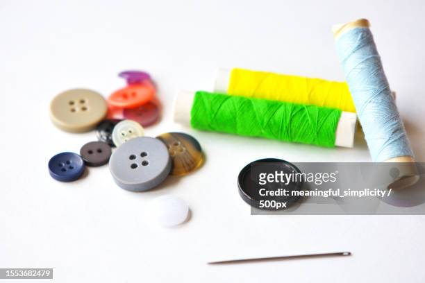 close-up of sewing items on table - button craft stock pictures, royalty-free photos & images