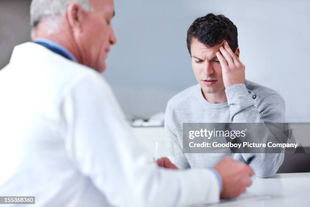 "thanks, doc" - man headache stock pictures, royalty-free photos & images