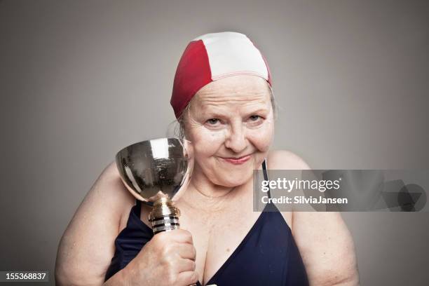 proud senior woman wins swim trophy - old woman in swimsuit stock pictures, royalty-free photos & images