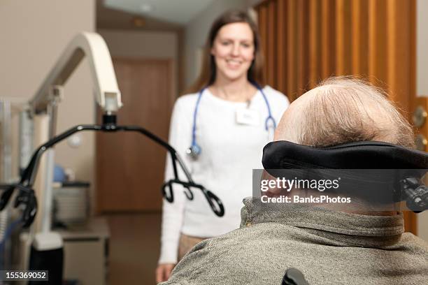 home healthcare nurse approaches a patient - multiple sclerose stockfoto's en -beelden