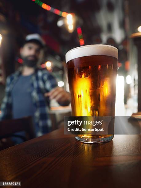 drinking craft beer. - craft beer stock pictures, royalty-free photos & images