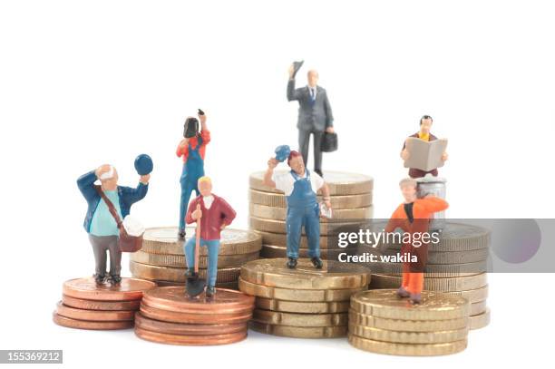 miniature business people on stacks of coins - job seekers outside the ministry of labor employment ahead of job creation figures stockfoto's en -beelden