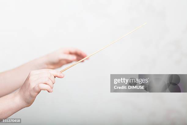 conductor - conductor's baton stock pictures, royalty-free photos & images