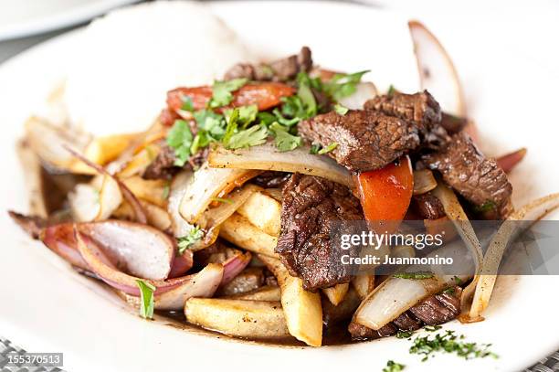 lomo saltado (peruvian stir-fried beef) - peruvian food stock pictures, royalty-free photos & images