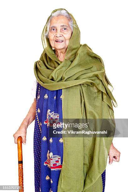 cheerful indian senior aged woman with walking stick - indian crutch stock pictures, royalty-free photos & images