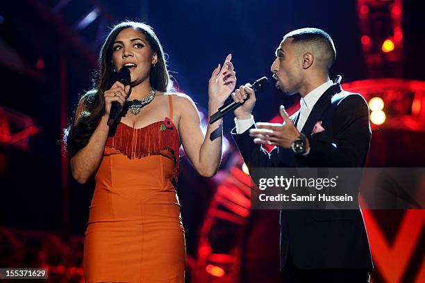 Hosts Miquita Oliver and Adam Deacon speak onstage at the 2012 MOBO awards at Echo Arena on November 3, 2012 in Liverpool, England.