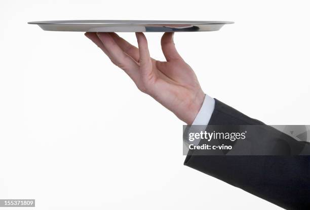 bandeja de plata con la mano - bandeja para servir fotografías e imágenes de stock