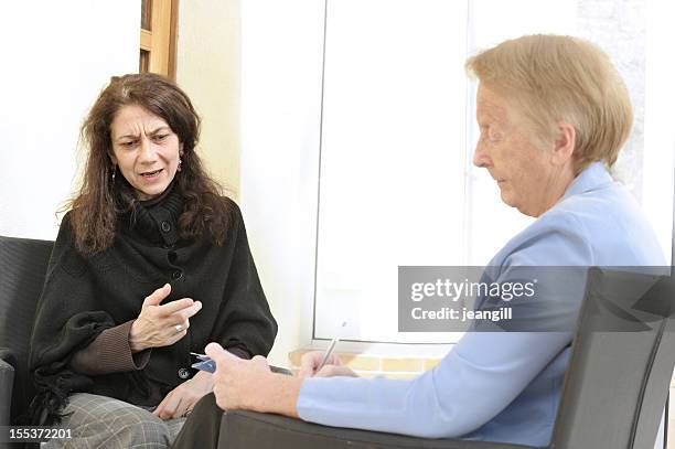 fragile woman in counselling session - probation stock pictures, royalty-free photos & images