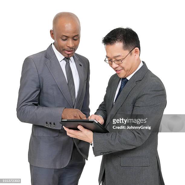 african and chinese businessmen working together - two people plain background stock pictures, royalty-free photos & images