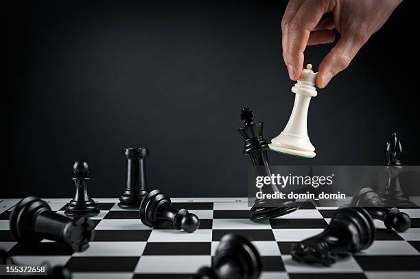 checkmate strategy, chess player or businessman making his checkmate move - bishop chess stock pictures, royalty-free photos & images