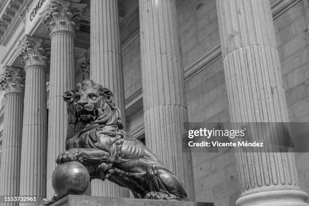 bronze lion of the congress of deputies - spanish congress stock pictures, royalty-free photos & images