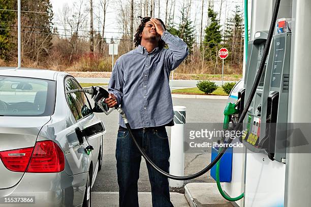 gas station frustration - gas prices stock pictures, royalty-free photos & images