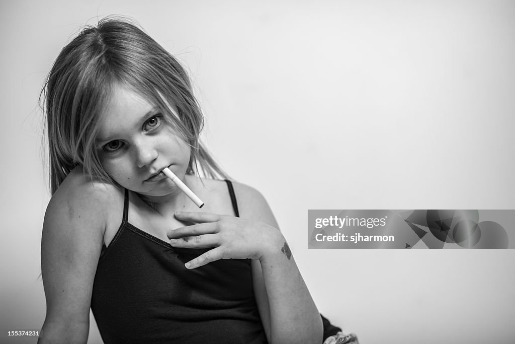 Portrait, Young Girl with Cigarette in Mouth, Looking at Camera