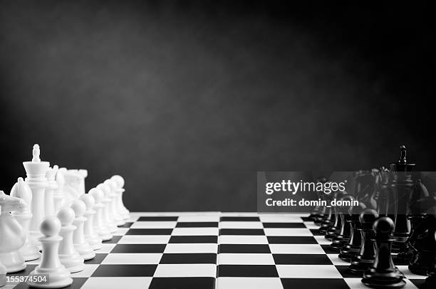 ready for chess battle on chessboard in black and white - chess board stock pictures, royalty-free photos & images