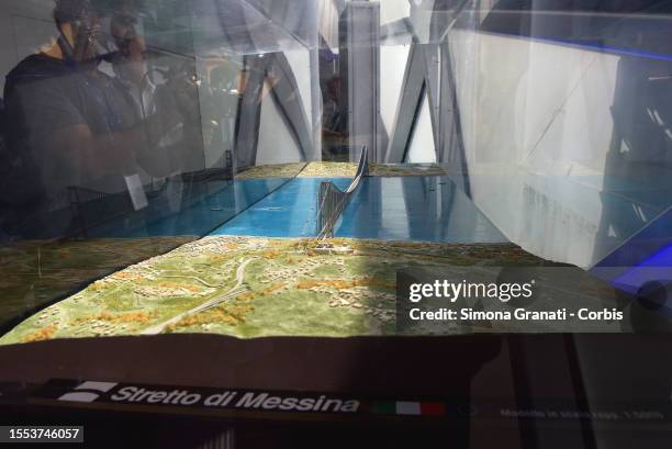 People look at the model of del The Strait of Messina Bridge , a planned suspension bridge across the Strait of Messina aimed to connect Sicily with...