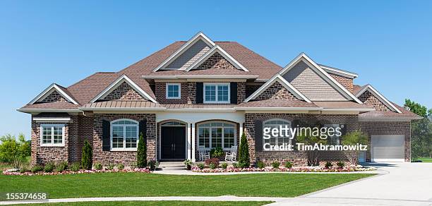 large american detached home with garden and blue sky - stone house stock pictures, royalty-free photos & images