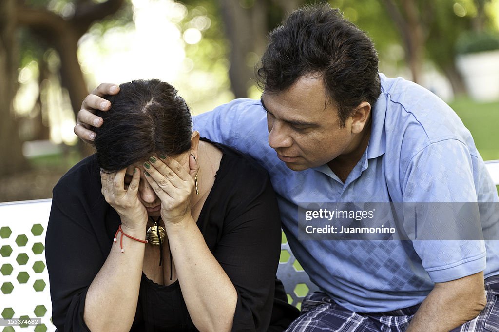 Concerned Hispanic Couple