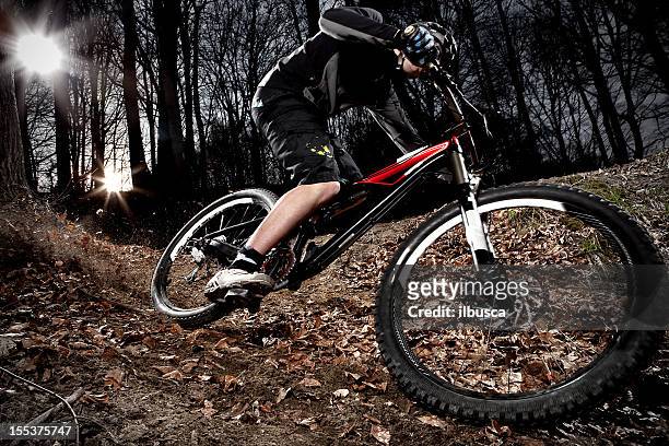 downhill enduro mountain bike curve in the woods - freestyle skiing stock pictures, royalty-free photos & images