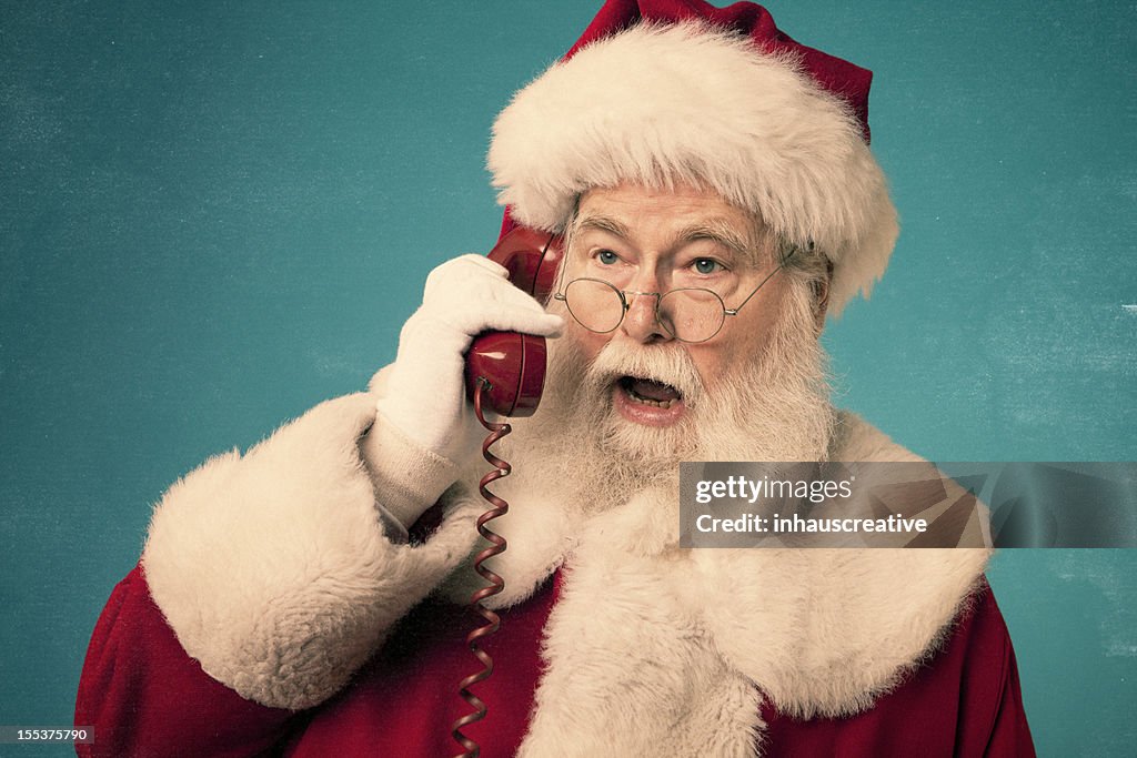 Pictures of Real Santa Claus on red phone