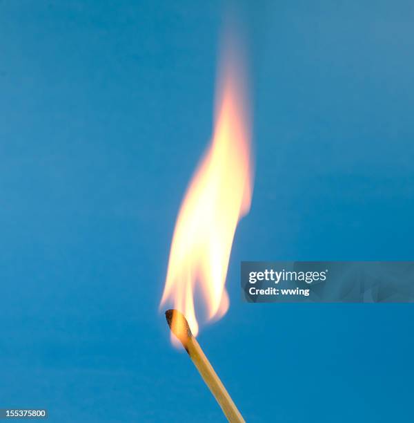 flaming match on blue - igniting flame stock pictures, royalty-free photos & images