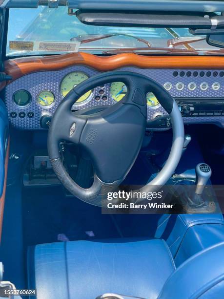 looking down at blue interior driver's side of parked morgan aero 8 convertible sports car, copake - morgan aero 8 stock pictures, royalty-free photos & images