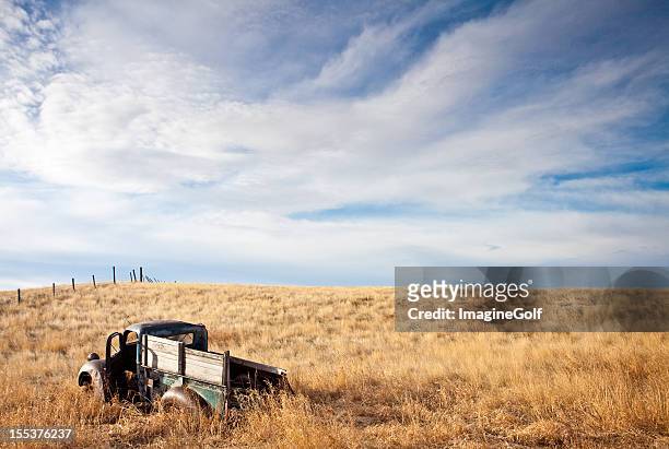 old abandoned truck on the plains - lethbridge alberta stock pictures, royalty-free photos & images