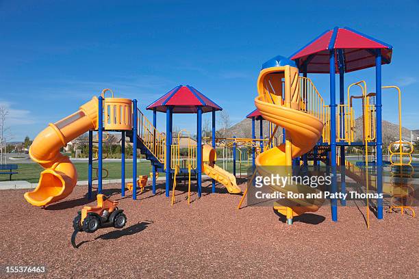 colorful kids outdoor playground equipment with slides - playground stock pictures, royalty-free photos & images