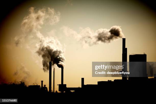 industry chimney and exhaust fumes - gas works stock pictures, royalty-free photos & images