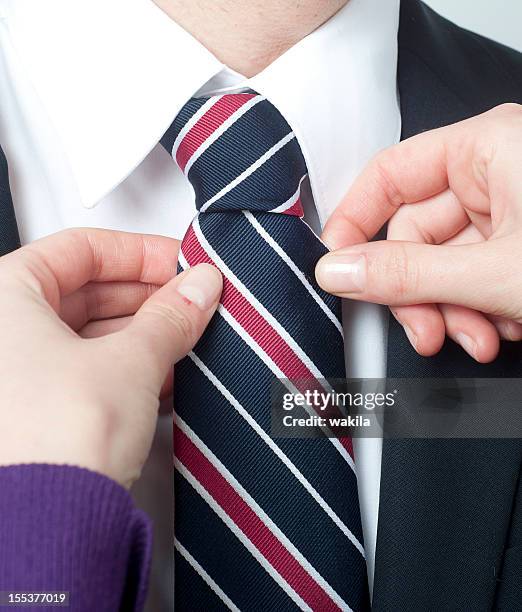 tie tie - ehefrau stockfoto's en -beelden