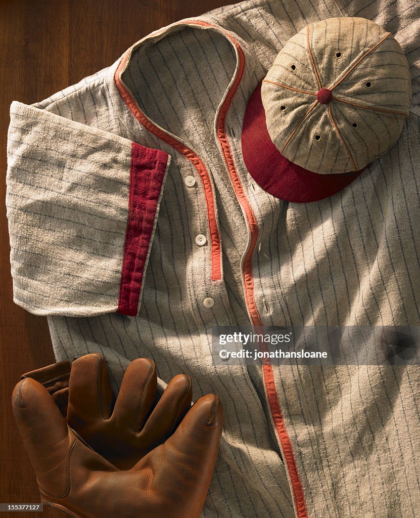 Old-time wool baseball uniform with cap and glove