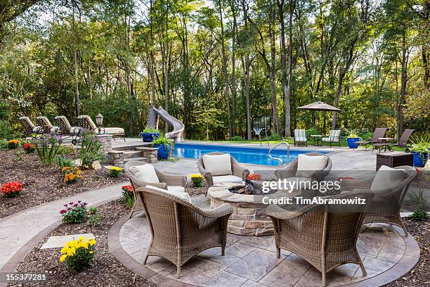 patio fire pit by swimming pool - byggnadsdetalj bildbanksfoton och bilder