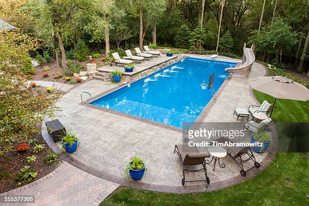 backyard swimming pool - swimming pool stock pictures, royalty-free photos & images