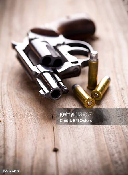 hand gun with bullets - gun safety stock pictures, royalty-free photos & images