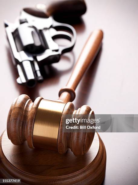 gavel and hand gun - rocket munition stock pictures, royalty-free photos & images