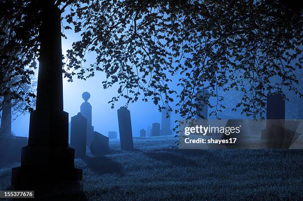 spooky blue graveyard - tombstone stock pictures, royalty-free photos & images