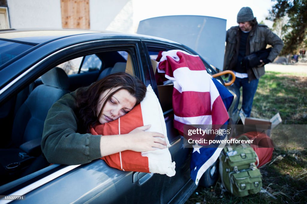 Homeless Couple Living Out of a Car