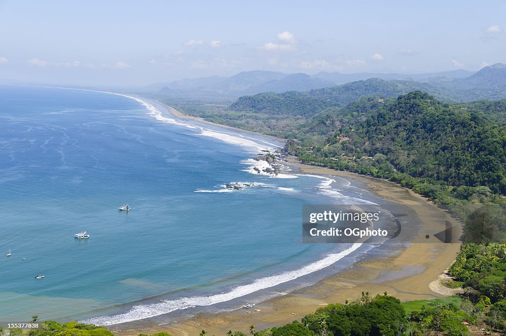 Aerial view of fishing boats and coastline. Dominical, Costa Rica