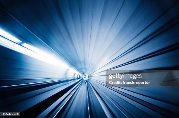 train runnin fast on the tunnel - motion blur effects - fast motion stock pictures, royalty-free photos & images