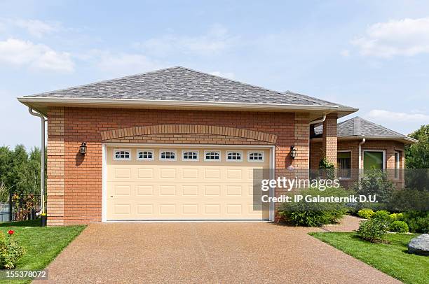 large brick garage in a suburban environment on a sunny day - modern driveway stock pictures, royalty-free photos & images