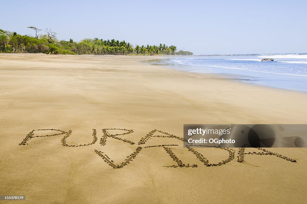 Pura Vida written on Costa Rican beach