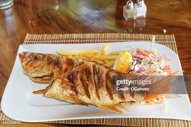 whole fried red snapper - snapper fish stock pictures, royalty-free photos & images