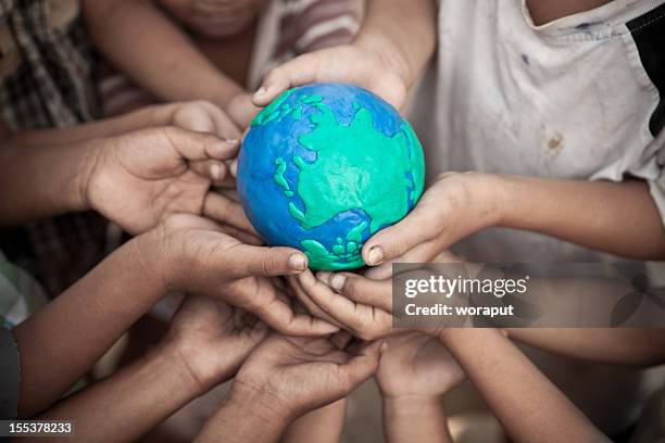 world connection concept - child globe stockfoto's en -beelden