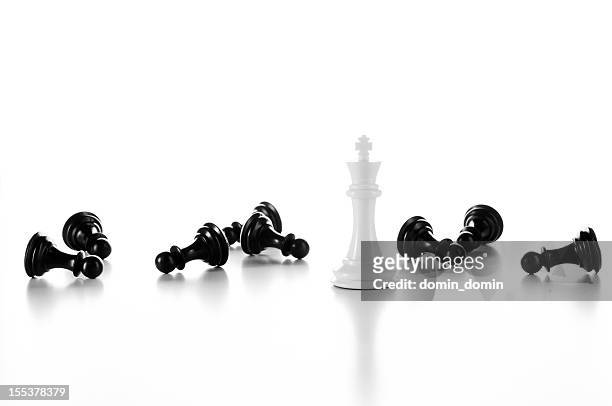 white chess king among lying black pawns, isolated on white - 卒子 個照片及圖片檔