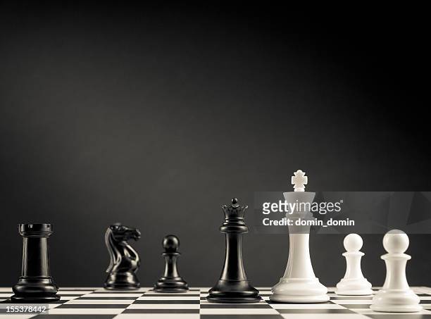 check move, black and white chess pieces on chess board - rook chess piece stock pictures, royalty-free photos & images