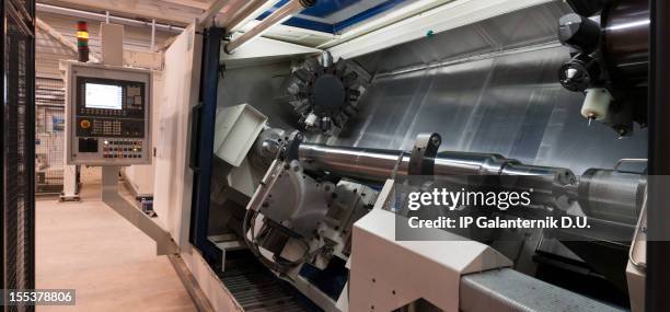 cnc machining tool.  modern industrial lathe. - turned out stock pictures, royalty-free photos & images