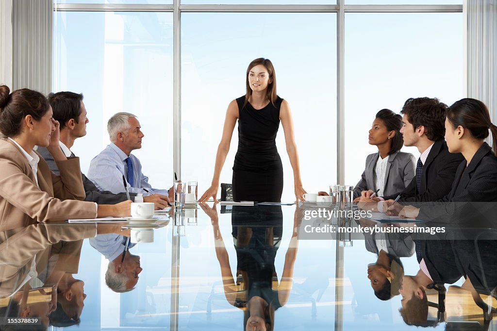 Group Of Business People Having Board Meeting