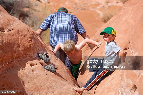 father and sons having fun - slot canyon stock pictures, royalty-free photos & images