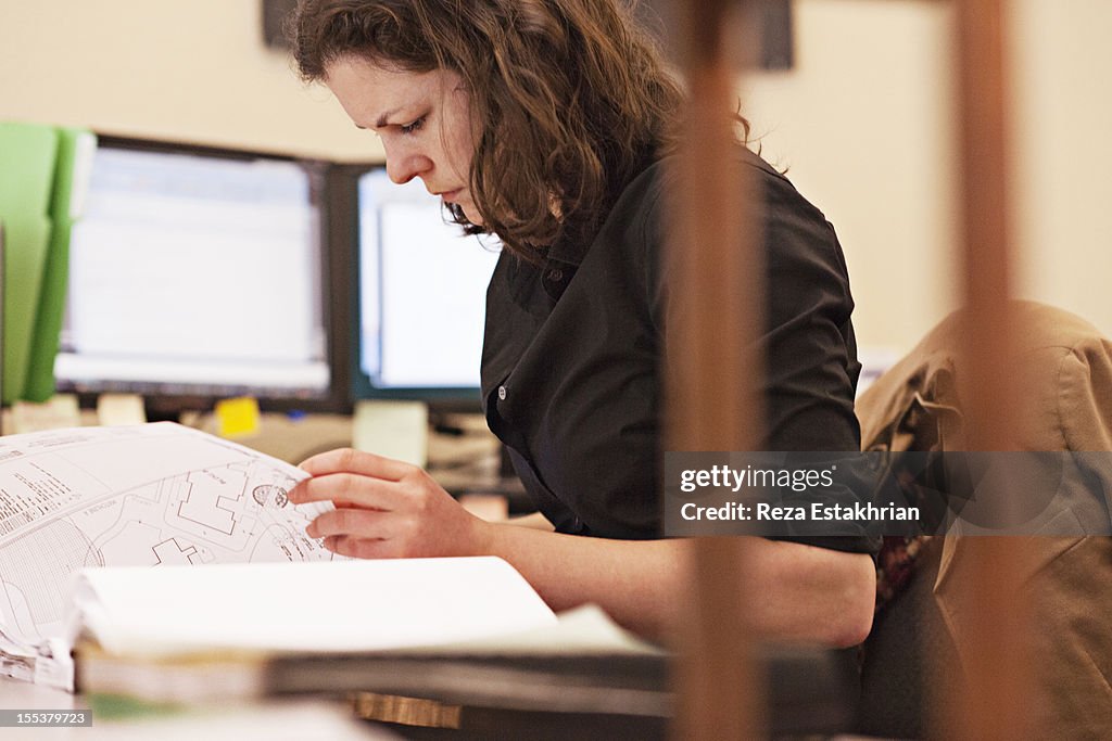Businesswoman checks paperwork
