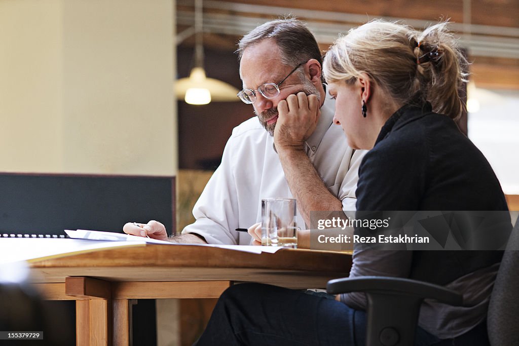 Coworkers in small meeting