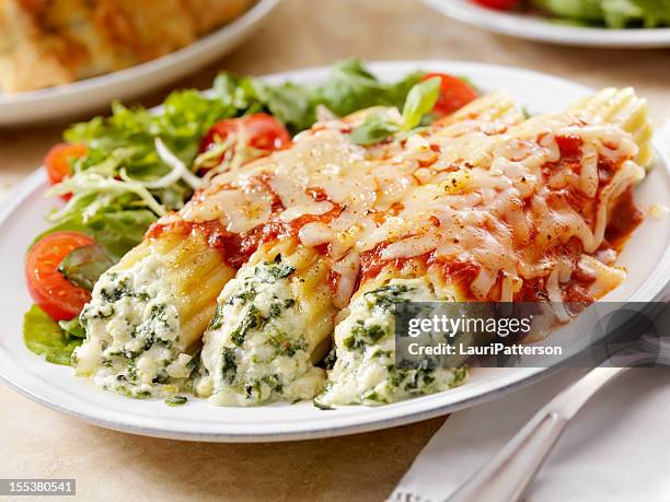 stuffed manicotti with ricotta and spinich - cannelloni stock pictures, royalty-free photos & images